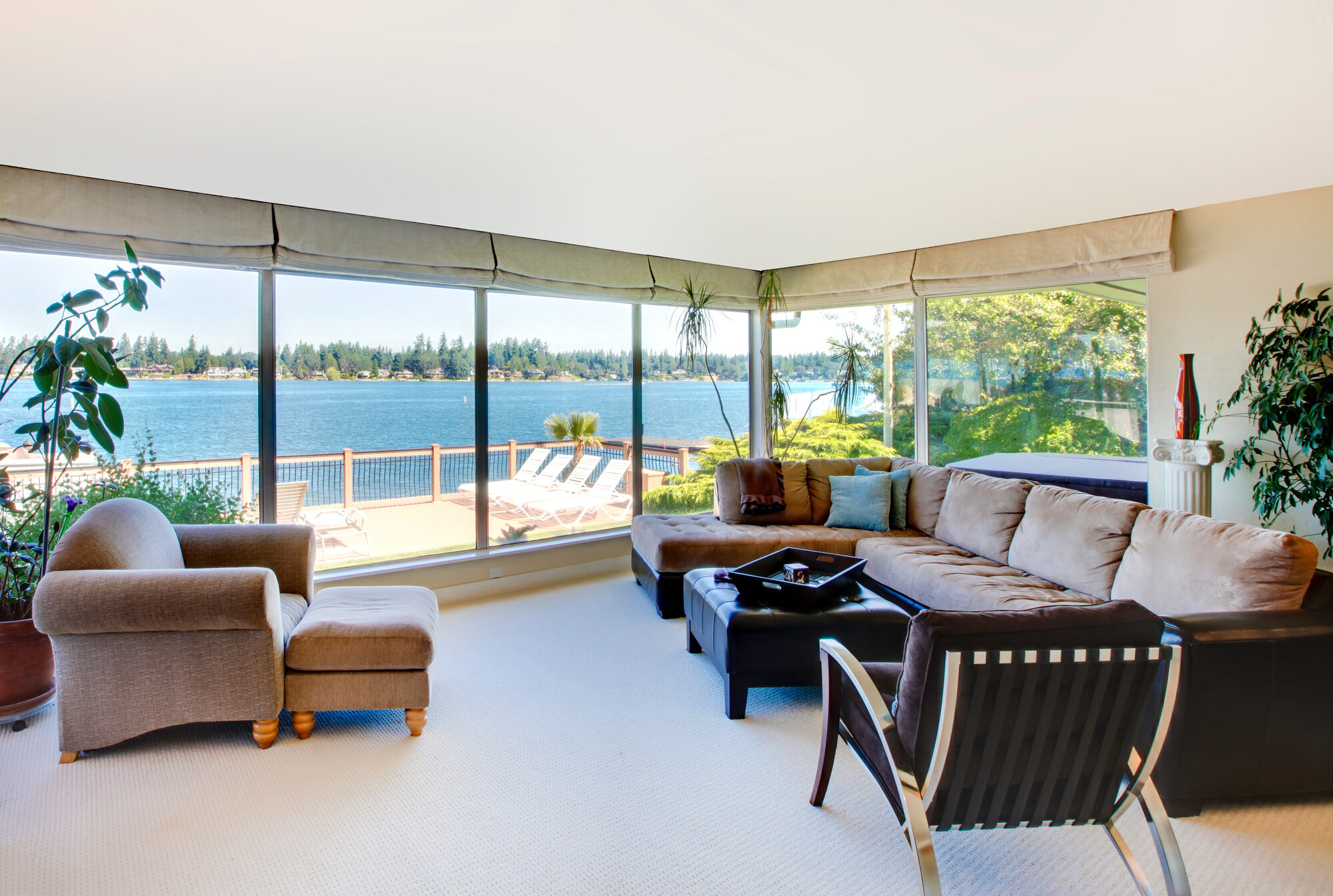 Sunroom with lake view furnished by Lakeshore Designs